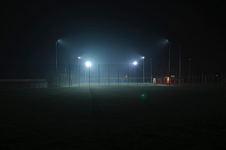 Football field with four lights on the court thumbnail