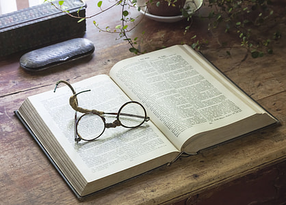 silver frame eyeglasses in white paper page thumbnail
