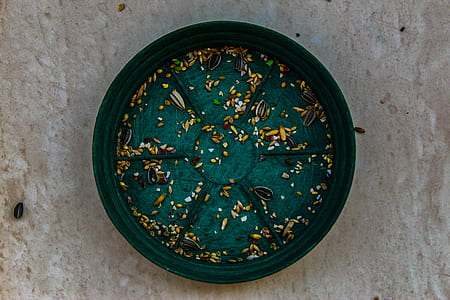 round green container on gray surface thumbnail