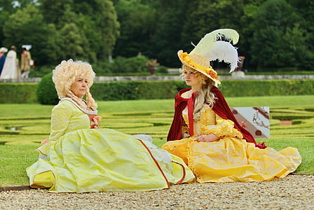 two medieval women sitting on grass thumbnail
