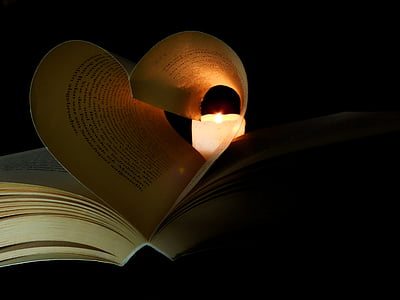 book near white candle thumbnail