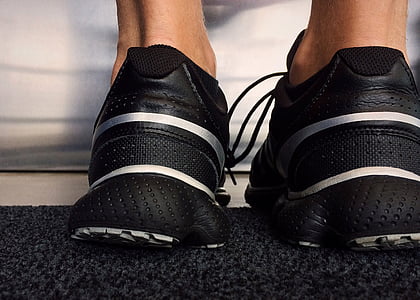 pair of black low-top sneakers thumbnail