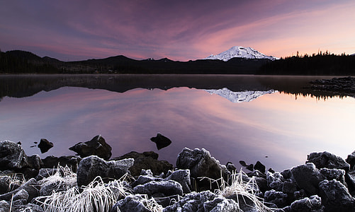 panoramic view on gray mountain and body of water thumbnail