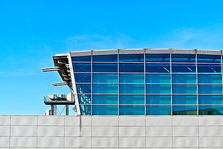 white metal frame building with blue glass panes thumbnail