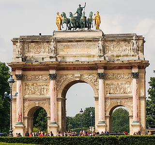 beige archway gate with statue thumbnail
