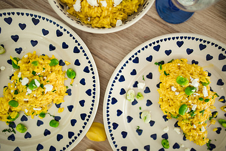 Risotto with broad bean on a cute plate with blue hearts thumbnail
