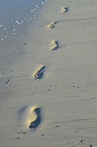 foot steps at seashore thumbnail