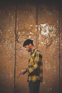man in black beanie staring at his hands thumbnail