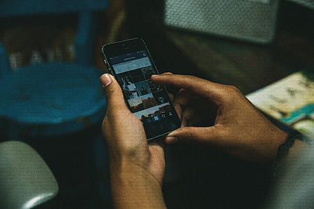 person holding space gray iPhone 5s thumbnail