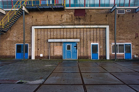 closed blue doors on building thumbnail