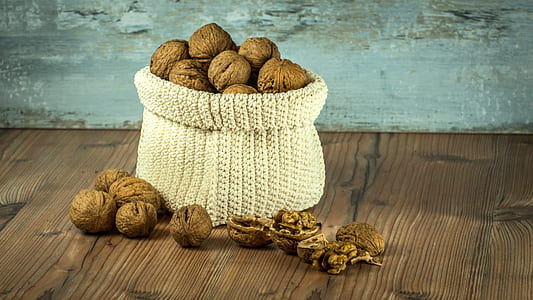 bunch of nuts in knitted basket thumbnail