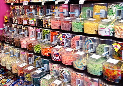 assorted candies in clear dispensers thumbnail