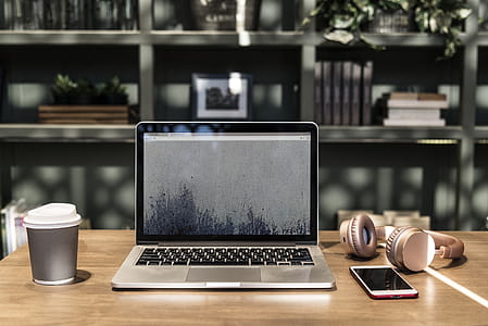 Macbook Pro on Top of Wooden Desk thumbnail