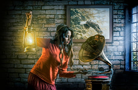 woman holding kerosene lantern standing beside the gramophone thumbnail