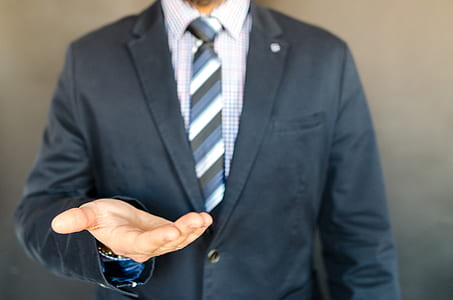 Man in Black Coat, White Dress Shirt and Black, Gray and White Necktie thumbnail