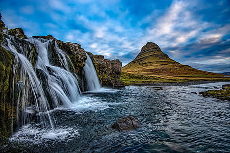 landscape photography of waterfalls and green mountain thumbnail