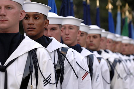 group of men wearing white uniform forming line thumbnail