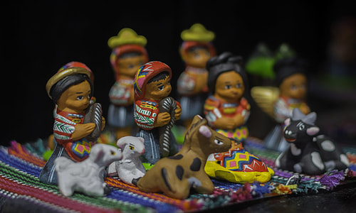ceramic figurines on orange textile thumbnail