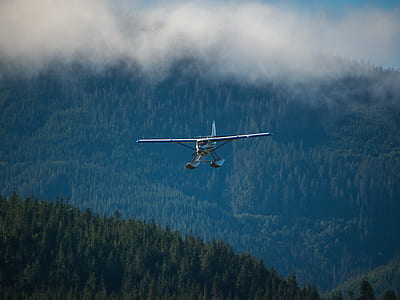 blue and white helicopter under blue sky thumbnail