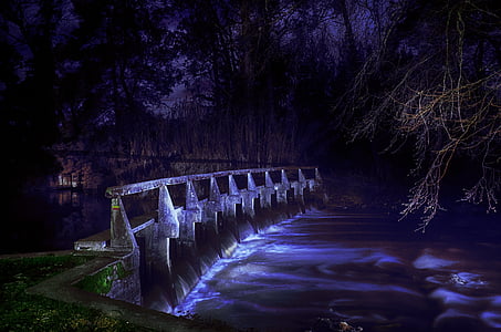 landscape photography of bridge and river during nighttime thumbnail