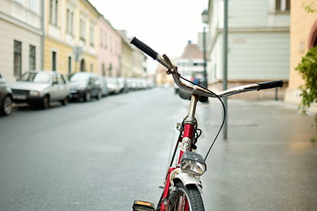 red bicycle on road thumbnail