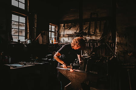 selective focus photography of man welding steel thumbnail