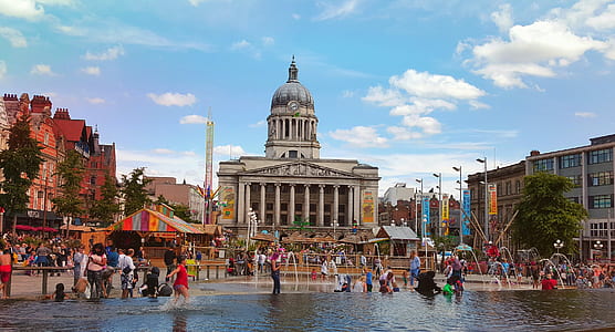 people on water near concrete building during daytime thumbnail
