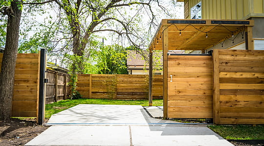 Photo of Opened Brown Wooden Sliding House Gate thumbnail