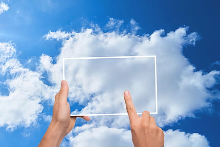 close-up photo of man touching screen thumbnail