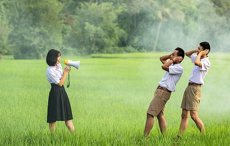 woman in white-and-black school uniform and two men in white-and-brown school uniforms thumbnail