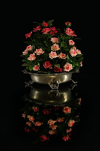 pink and red rose in gray footed vase centerpiece with reflection on black surface thumbnail