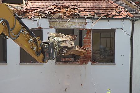 yellow heavy equipment destroying white house thumbnail