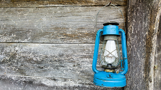blue kerosene lamp hanging on the wall thumbnail