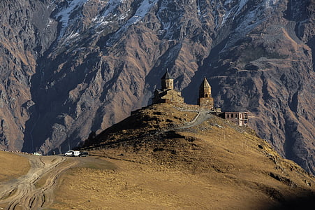 brown concrete tower on top of hill thumbnail