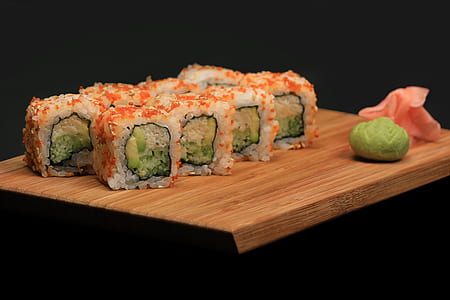 sushi on brown wooden chopping board thumbnail