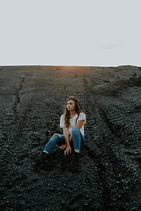 woman sitting on black dirt thumbnail