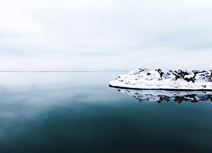 white snow on rock formation thumbnail