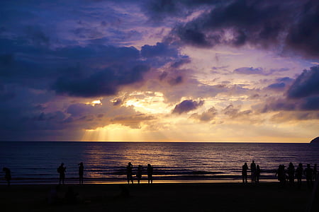 silhouette of people near beach thumbnail