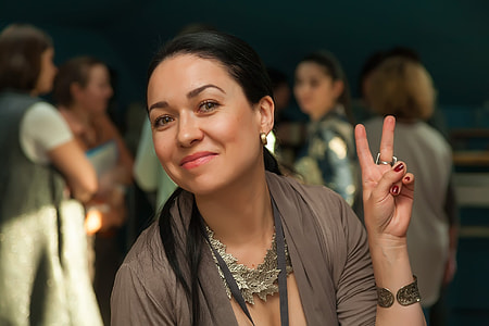 smiling woman taking selfie thumbnail