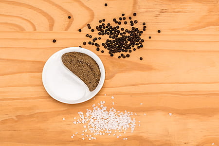 salt and pepper grains on brown wooden surface thumbnail