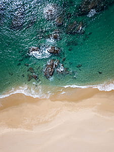 aerial shot of white sand beach thumbnail