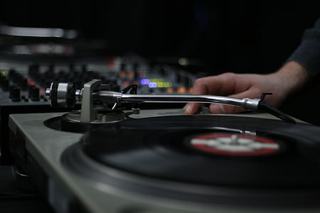 person using black turntable thumbnail