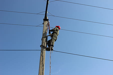 man fixing utility post thumbnail