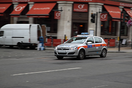 silver Opel Astra 5-door hatchback running on road thumbnail