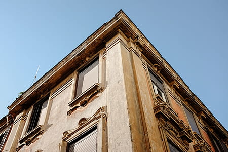 worm's eye view of brown building during daytime thumbnail