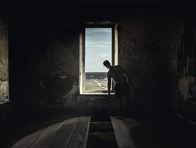 man looking at window thumbnail