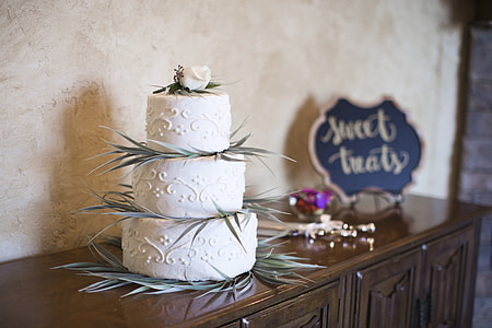 white 3-tier cake on sideboard thumbnail