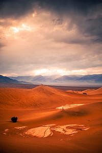 sand dunes under cloudy skies thumbnail