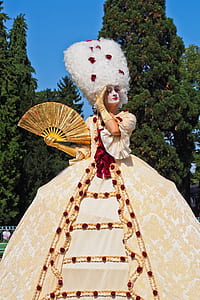 woman wearing royal gown holding hand fan thumbnail