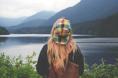 photo of person wearing brown leather knapsack thumbnail